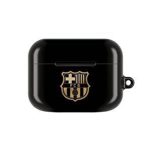 May include: Black protective case for wireless earbuds. The case features a gold emblem of the FC Barcelona soccer team. The case has a smooth, glossy finish and a small loop for attaching to a keychain or lanyard.