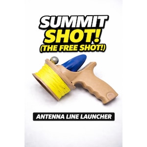 May include: A tan antenna line launcher with a blue component and a yellow spool of line. The text "SUMMIT SHOT! (THE FREE SHOT!)" is displayed above the launcher, with "ANTENNA LINE LAUNCHER" below.