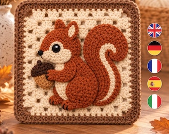 Könnte beinhalten: Ein quadratisches Häkelquadrat im Granny-Square-Stil mit einer dreidimensionalen Applikation eines braunen Eichhörnchens, das eine kleine braune Eichel hält. Das Eichhörnchen hat einen cremefarbenen Bauch und ein Gesicht sowie einen buschigen Schwanz.