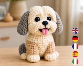 Könnte beinhalten: Ein gehäkeltes Stoffhund-Spielzeug mit cremefarbenem Garn für Kopf und Brust, hellbraunem Garn für den Unterkörper und grauem Garn für Ohren und Schwanz. Das Spielzeug hat große schwarze Kunststoffaugen, eine schwarze Nase und eine herausgestreckte Zunge.