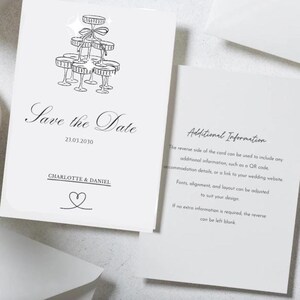 May include: White wedding invitation card with a champagne tower illustration and the text "Save the Date". The card includes the date 23.03.2030, names "CHARLOTTE & DANIEL", and a heart symbol. Additional information is on the reverse.