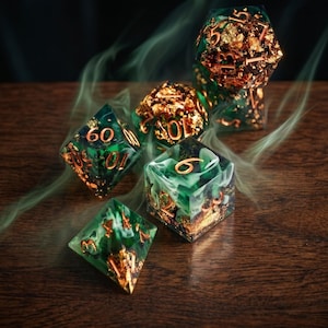 May include: A set of polyhedral dice made from translucent green resin with swirling white clouds and embedded gold leaf flakes. The dice feature sharp edges and engraved copper-colored numbers, surrounded by wisps of green smoke.