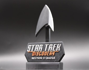 Réplica para cosplay del Combandage de la Flota Estelar de la Sección 31 de Star Trek Discovery, Voyager, DS9, SNW con soporte de exhibición.