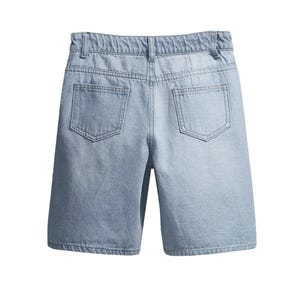 May include: Pale blue denim shorts featuring two back pockets and a waistband. The shorts are crafted from a light wash denim fabric and have a relaxed fit. Suitable for casual wear, these shorts are a versatile wardrobe staple.