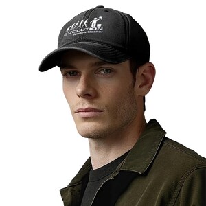 May include: Black baseball cap with a curved brim. The cap features the white text "EVOLUTION Window Cleaner" above a graphic of an evolutionary sequence. The cap is worn by a person.