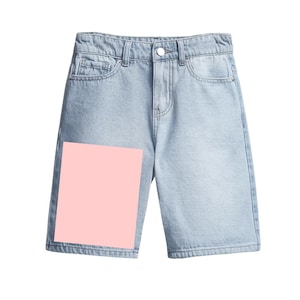 May include: Light blue denim shorts with a classic five-pocket design. The shorts have a button and zipper closure and a light wash. The shorts have a pink square covering the left leg.