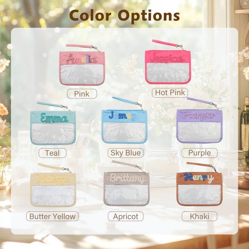 May include: A collection of eight rectangular zippered pouches with wrist straps, each featuring a clear plastic front panel and a colored fabric top section embroidered with a name. Colors include pink, hot pink, teal, sky blue, purple, butter yellow, apricot, and khaki.