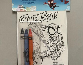 May include: A clear plastic bag containing a coloring book and three crayons. The coloring book features a Spidey and Amazing Friends design. The top of the bag has a blue banner with the text "Thank you for swinging by Jacob's 3rd birthday!"