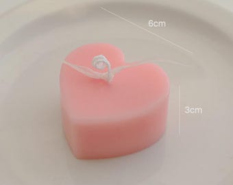 Vela em formato de coração rosa