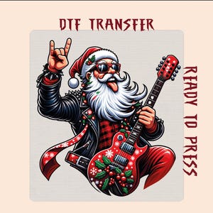 May include: A DTF transfer ready to press featuring a rock-and-roll Santa Claus with a white beard, sunglasses, and a red hat. Santa wears a black leather jacket and plays a red electric guitar decorated with holly leaves and white snowflakes.