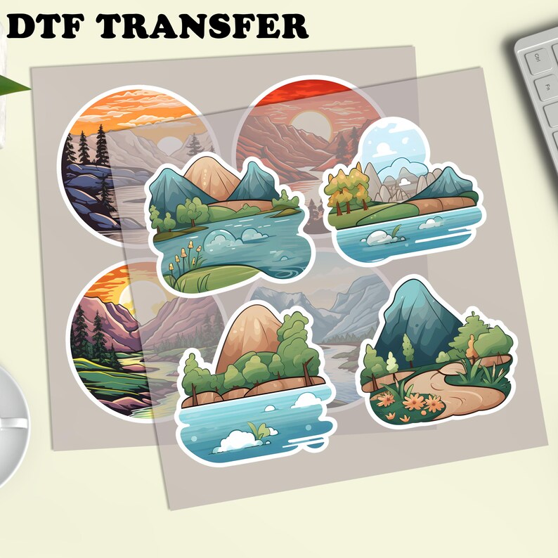 Puede incluir: Una hoja de pegatinas de transferencia DTF con dise&ntilde;os de paisajes. Cada pegatina presenta monta&ntilde;as, agua, &aacute;rboles y puestas de sol en colores vibrantes. Las pegatinas est&aacute;n sobre un fondo gris claro. El texto 'DTF TRANSFER' est&aacute; en la parte superior.