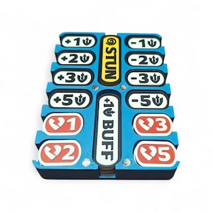 May include: A blue and black game accessory with slots for tokens. It features labels like "STUN" and "+1 BUFF", along with numerical indicators such as +1, +2, +3, +5, -1, -2, -3, and -5. Red tokens with numbers 1, 2, 3, and 5 are also present.