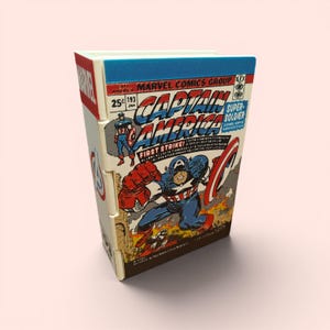 May include: A rectangular storage box featuring a graphic print of a vintage Captain America comic book cover. The design includes the Marvel logo, the title Captain America, and an illustration of the character in a blue and red suit.