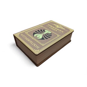 May include: A closed, brown book with gold trim and the text "Strixhaven Codex" and "Witherbloom" on the cover. The cover features a green and black design. The book is on a white background.