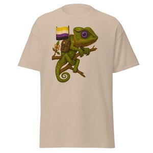 May include: A set of three ceramic mugs with a speckled, cream-colored glaze. Each mug features a different hand-painted design: a blue and green leaf, a yellow flower, and a red berry. The mugs have a simple, rounded shape.