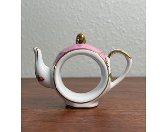 Cracker Barrel theepot servetring | Roze porselein met gouden randje, verzamelobject