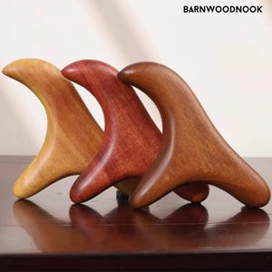 May include: A set of three ceramic mugs with a speckled, matte finish. The mugs are in shades of cream, light gray, and dark gray. Each mug has a simple, minimalist design and a rounded handle.