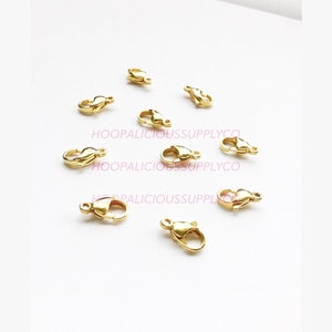 14mm Stainless Steel Gold Clasp. WILL NOT TARNISH or Rust. Lobster Claw. Jewelry Findings. Also Available in 9mm and 12mm. Sold Per Piece.
