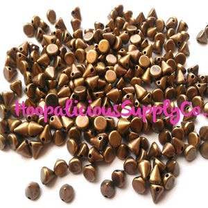 100pc 6mm Morsel Cone Studs. Tiny. Sew or Glue on. Craft Supplies. DIY. T-shirts. Shoes. Jackets. Costumes. We’re in the USA. 5 Star Reviews image 3