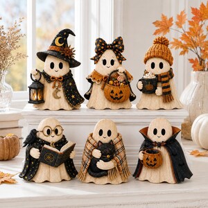 May include: Six decorative ghost figurines arranged in two rows. The top row features a ghost with a witch hat and lantern, a ghost with a bow and pumpkin basket, and a ghost with a beanie and mug. The bottom row shows a ghost reading a book with a crow, a ghost holding a black cat, and a ghost in a vampire cape holding a pumpkin mug.