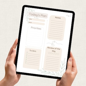 Könnte beinhalten: Ein digitaler Planer auf einem Tablet, mit Abschnitten für "Today's Plan", "Priorities", "To Do's", "Notes" und "Review of the day". Das Design verwendet eine sanfte Farbpalette mit botanischen Akzenten.