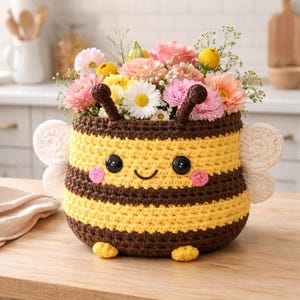 May include: A white ceramic mug with a black handle and the text "But First, Coffee" in a bold, black font. The mug is set against a neutral background, highlighting its simple design.