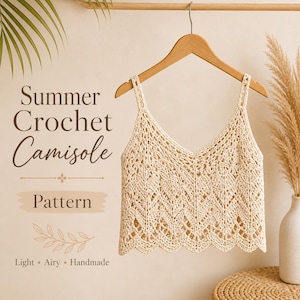 May include: A cream-coloured crochet camisole hangs on a wooden hanger. The top features a V-neck and a scalloped hemline. The words "Summer Crochet Camisole Pattern" are displayed in the image, along with the words "Light, Airy, Handmade."
