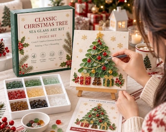 May include: A Classic Christmas Tree sea glass art kit featuring a box, a white tray with nine compartments of colored glass pieces, a small bowl, a step-by-step guide, and a square canvas on a wooden easel displaying a completed tree design.