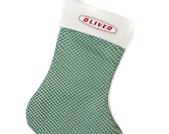 Calza di Natale con logo Oliver, a quadretti verdi con logo ovale Oliver a tre cifre