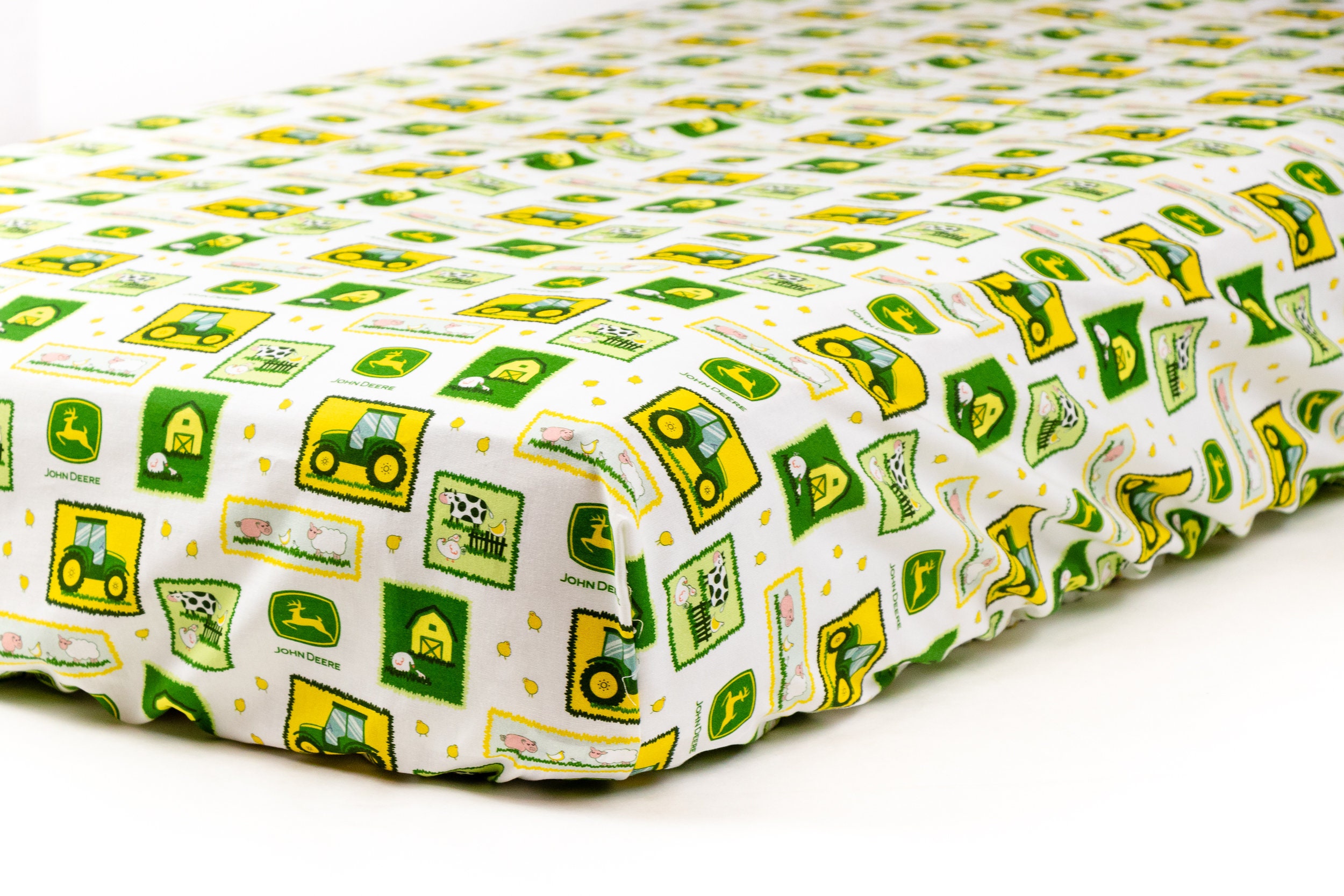 Tractor Crib Sheet displaying John Deere tractors and logos Etsy