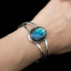 May include: A set of three ceramic mugs with a speckled, matte finish. The mugs are in shades of cream, light gray, and dark gray. Each mug has a simple, minimalist design, perfect for coffee or tea.