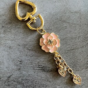 Pink flower with heart charms