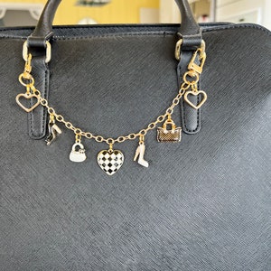 Purse charm with black and white charms