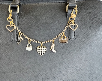 Purse charm with black and white charms