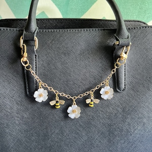 Purse charm on chain with flowers and bees