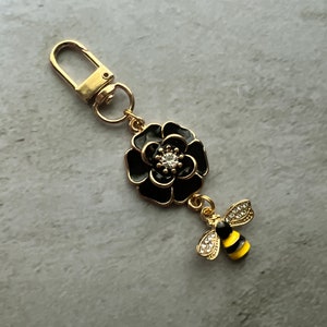 Purse charm black flower dangle with bee charm