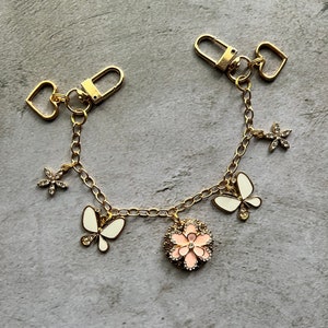 Purse charm with butterflies and heart charms