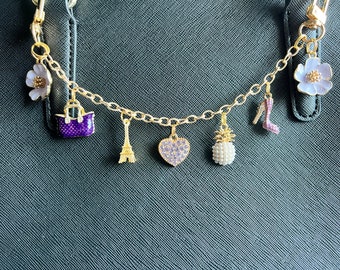 Purple purse charm with pineapple and flowers