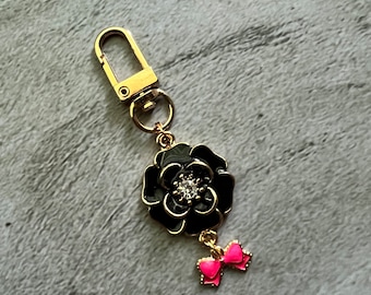 Black flower purse charm with bow charm