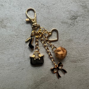 purse charm with black accessory charms