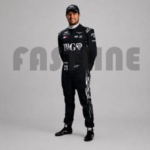May include: A black racing suit featuring white sponsor logos, the text TWG, and the number 11 on the chest. The suit includes a chequered pattern along the legs, a high collar, and a matching black cap. The word FASTLINE is visible in the background.