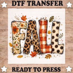 May include: A DTF transfer sheet featuring the word FALL in large block letters. The F has a floral pattern, the A has a leopard print, the L has a red and white buffalo plaid, and the second L has a cream and black polka dot pattern.