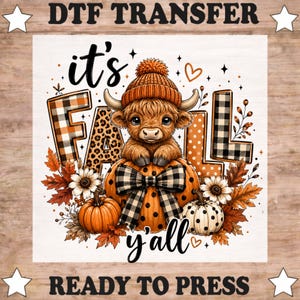 May include: A DTF transfer featuring a fluffy highland cow wearing an orange knit hat, sitting on a large orange pumpkin with a black and white buffalo plaid bow. The text reads it's FALL y'all, surrounded by autumn leaves, sunflowers, and pumpkins.