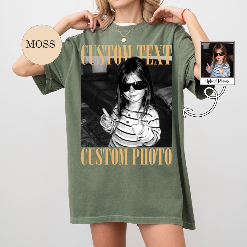 May include: An olive green oversized t-shirt featuring a black and white photograph of a child wearing sunglasses and a striped shirt. The text CUSTOM TEXT appears above the photo and CUSTOM PHOTO appears below it in a bold, tan, serif font.