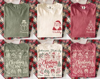 May include: A collection of six t-shirts in olive green, cream, and maroon. The top row features a snowman, Santa, and Christmas tree with labels Mommy, Daddy, and Brother. The bottom row displays a Christmas Crew graphic with Johnson Family text.