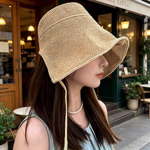 Sombrero de sol de punto de paja de algodón y lino para mujer, ajustable con cordón, ala ancha, estilo cubo, protección UV, ideal para el verano.