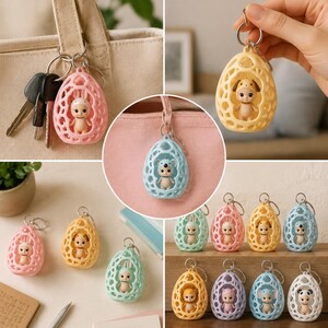 K&ouml;nnte beinhalten: Eine Sammlung farbenfroher Schl&uuml;sselanh&auml;nger mit kleinen Tierfiguren in eif&ouml;rmigen, durchbrochenen Geh&auml;usen. Die Schl&uuml;sselanh&auml;nger sind in verschiedenen Pastellfarben erh&auml;ltlich, darunter Rosa, Gelb, Blau und Gr&uuml;n, mit verschiedenen Tierdesigns.