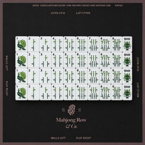 May include: A set of white Mahjong tiles arranged in four rows on a dark background. The tiles feature green bamboo, peacock, and dragon illustrations with black text. The board includes text labels like Walls Left, Play Right, and Mahjong Row & Co.