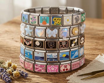 May include: A cylindrical modular link bracelet featuring five horizontal rows of interchangeable stainless steel links. Each link displays colorful enamel designs including flowers, a starfish, a heart, a butterfly, a jellyfish, a shell, an eight ball, a camera, a bow, a bee, a panda, ocean waves, a sailboat, cherries, and the text 777.