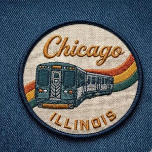 May include: A circular embroidered patch on a blue denim background featuring a teal train car moving across a background of orange, yellow, and green stripes. The text Chicago is embroidered in brown above the train and Illinois below it.